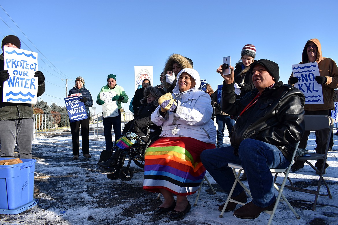 FILE - In this Oct. 29, 2019 file photo, opponents of the Keystone XL oil pipeline from Canada demonstrate in sub-freezing temperatures in Billings, Mont. Alberta is investing $1.1 billion in the disputed Keystone XL pipeline, a project that Alberta Premier Jason Kenney says is crucial for the province's economy. (AP Photo/Matthew Brown, File)