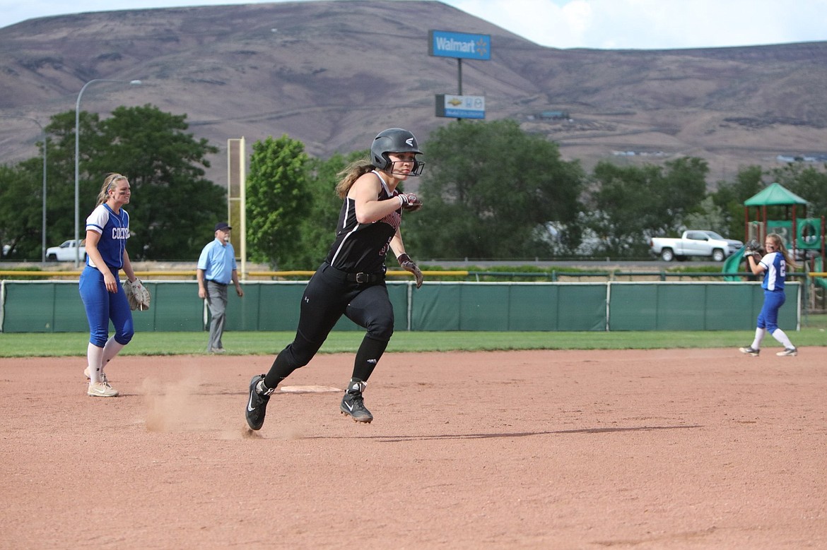 Almira/Coulee-Hartline High School senior Makenna Oliver makes her way toward home during a game last season for the Warriors, on her way to a second consecutive 1B state championship.