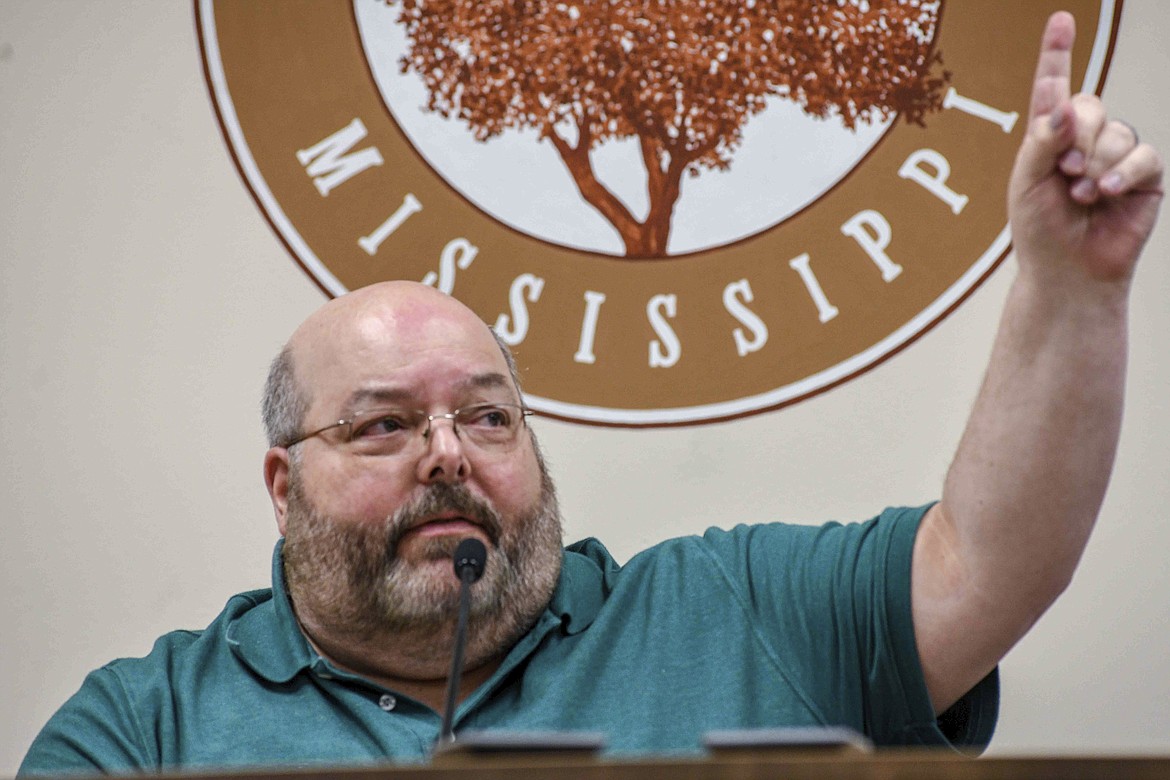 Petal Mayor Hal Marx raises his hand and refuses to resign at a special board of aldermen meeting at Petal City Hall, Thursday, May 28, 2020, in Petal, Miss., over comments he made about the death of Minneapolis man George Floyd at the hands of police, on social media. (Cam Bonelli/Hattiesburg American via AP)