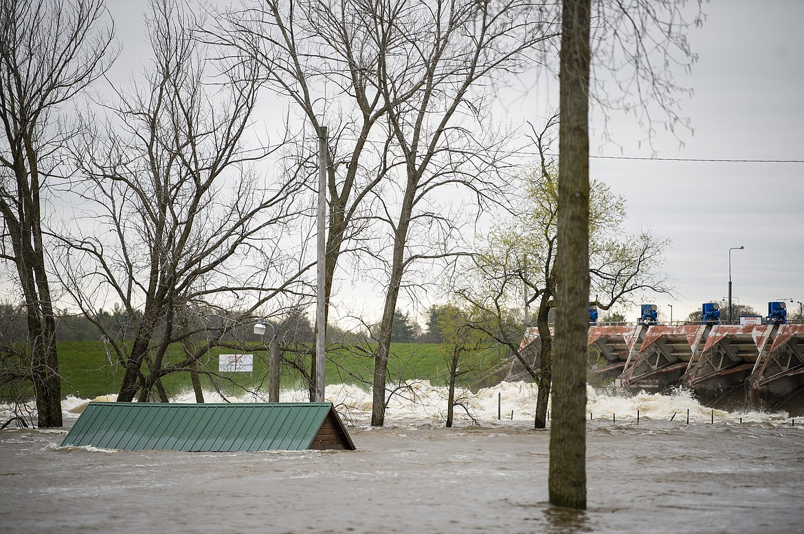 A view of the flooded area near the Sanford dam on Tuesday, May 19, 2020. Residents were told to evacuate due to the dams on Sanford and Wixom Lakes no longer being able to control or contain the amount of water flowing through the spill gates. (Kaytie Boomer/MLive.com/The Bay City Times via AP)