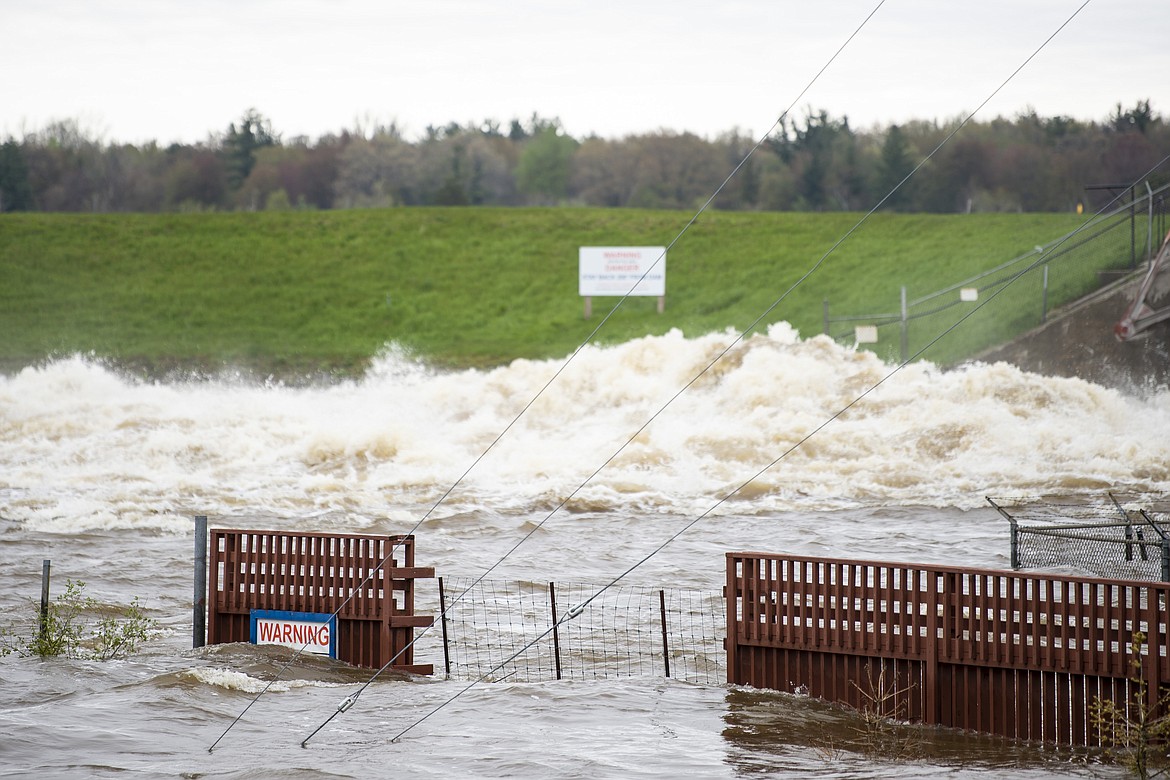 A view of the flooded area near the Sanford Dam on Tuesday, May 19, 2020. Residents were told to evacuate due to the dams on Sanford and Wixom Lakes no longer being able to control or contain the amount of water flowing through the spill gates. (Kaytie Boomer/MLive.com/The Bay City Times via AP)