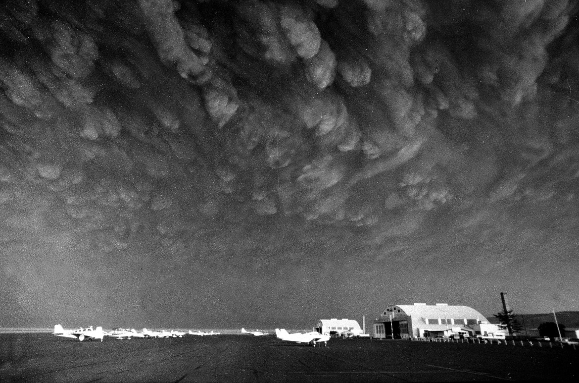 FILE - In this May 19, 1980, file photo, clouds of ash from the eruption of the Mount St. Helens volcano move over the Ephrata Airport in Ephrata, Wash. May 18, 2020, is the 40th anniversary of the eruption, which darkened skies and sent volcanic ash falling for hundreds of miles. (AP Photo/Mike Cash, File)