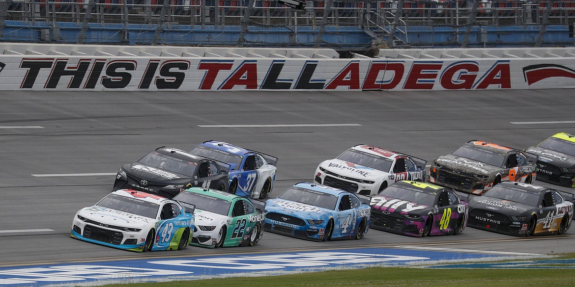 Monster Energy NASCAR Cup Series driver Bubba Wallace (43) leads the pack during a NASCAR Cup Series auto race at Talladega Superspeedway in Talladega Ala., Monday, June 22, 2020. (AP Photo/John Bazemore)