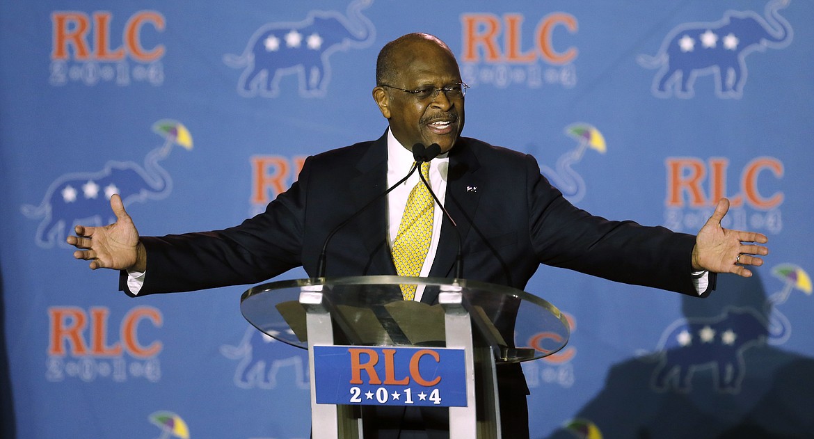 FILE - In this May 31, 2014 file photo, Herman Cain addresses the Republican Leadership Conference in New Orleans, La.  Cain has died after battling the coronavirus. A post on Cain's Twitter account on Thursday, July 30, 2020 announced the death.  (AP Photo/Bill Haber, File)