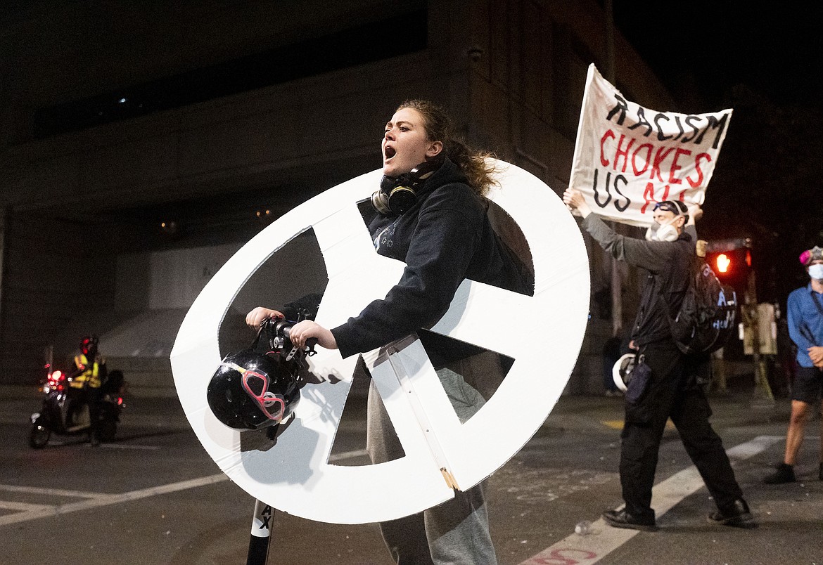 KaCe Freeman chants during a Black Lives Matter protest outside the Mark O. Hatfield United States Courthouse in Portland, Ore. on July 20, 2020. (AP Photo/Noah Berger)