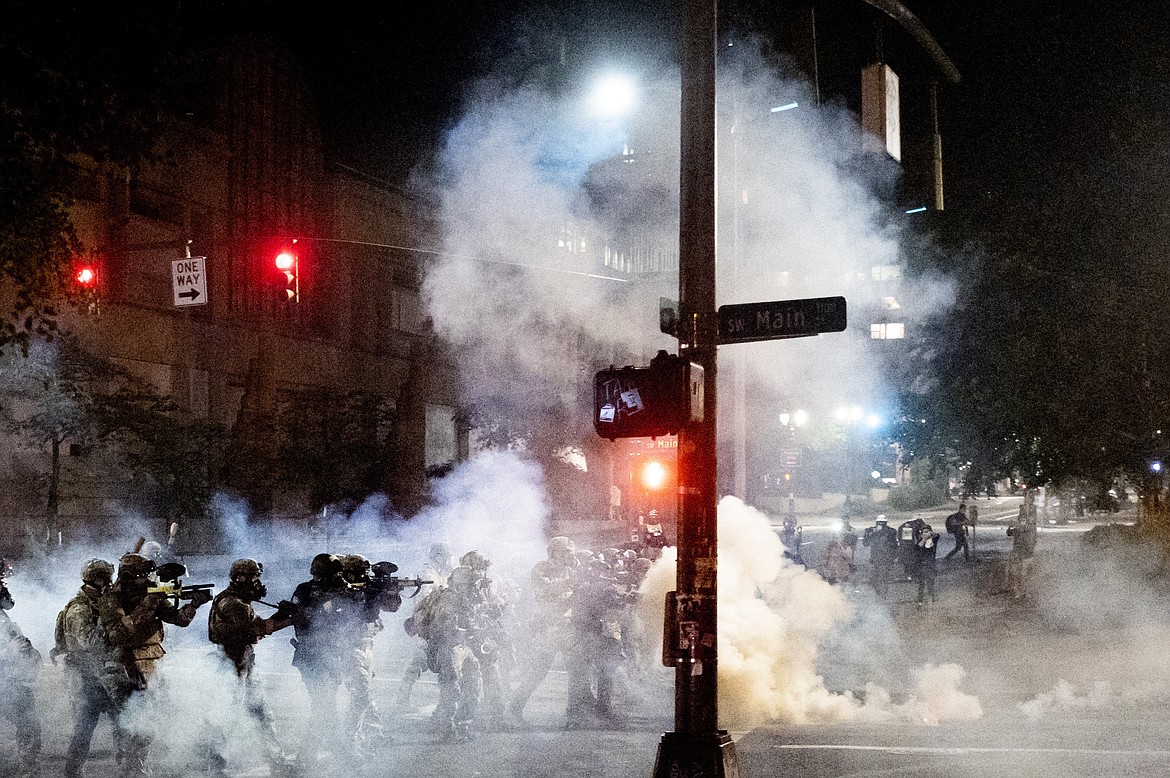 Federal agents use crowd control munitions to disperse Black Lives Matter protesters near the Mark O. Hatfield United States Courthouse in Portland, Ore. on July 20, 2020. (AP Photo/Noah Berger)