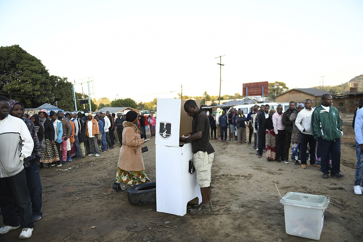 People line up to cast their votes in Blantyre, Malawi Tuesday, June 23 2020, in a rerun of the presidential poll after the courts nullified the results of the election held more than a year earlier. (AP Photo/Thoko Chikondi)