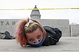The Latest: Denver officer won't be prosecuted for shooting