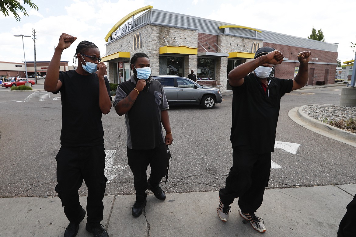 Workers walk out to a protester rally outside a McDonald's in Detroit, Monday, July 20, 2020. The national workers strike saw people walk off the job Monday in U.S. cities to protest systemic racism and economic inequality. (AP Photo/Paul Sancya)