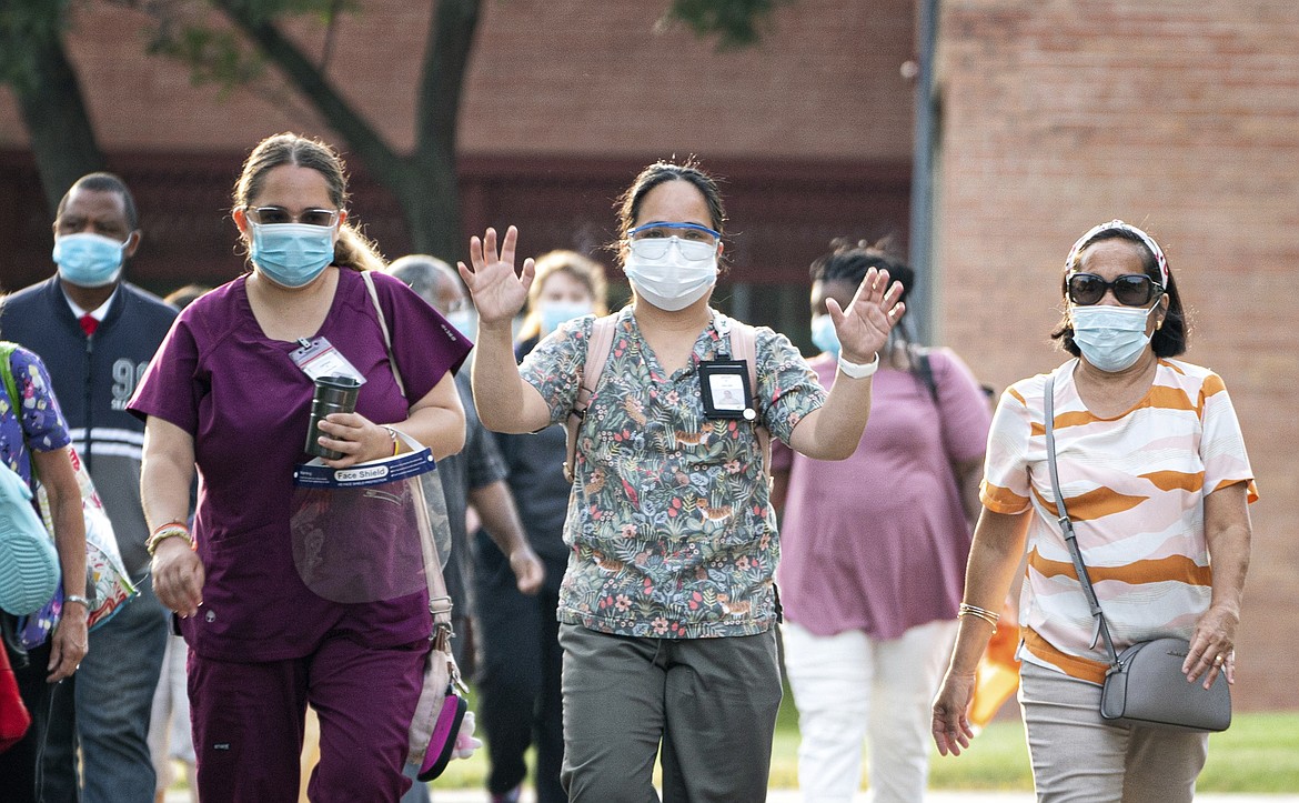 Nursing assistants, dietary workers and housekeepers and janitors went on strike outside Cerenity HumboltCare Center in St Paul, Monday, July 20, 2020, calling for fair pay, paid sick time and safer working conditions. July 20 is National Strike for Black Lives, a day calling for a day of action to emphasize good jobs and racial justice in over 25 cities across the U.S. (Glen Stubbe/Star Tribune via AP)