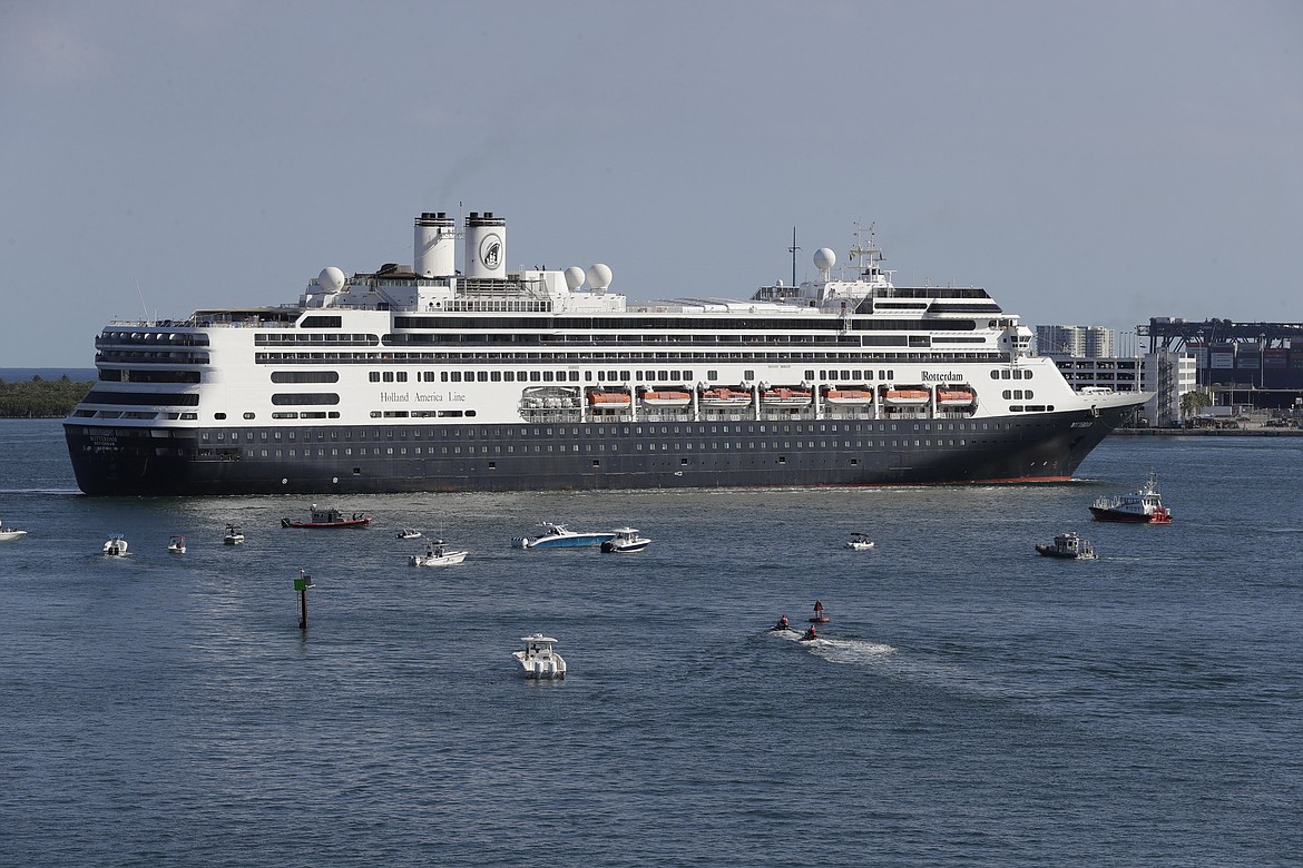 FILE - The cruise ship Rotterdam turns as it prepares to dock at Port Everglades, Thursday, April 2, 2020, in Fort Lauderdale, Fla. Federal health officials are extending the U.S. ban on cruise ships through the end September as coronavirus infections rise in most U.S. states, including Florida. The Centers for Disease Control and Prevention announced Thursday, July 16, 2020 that it was extending a no-sail order that had been scheduled to expire July 24. (AP Photo/Wilfredo Lee)