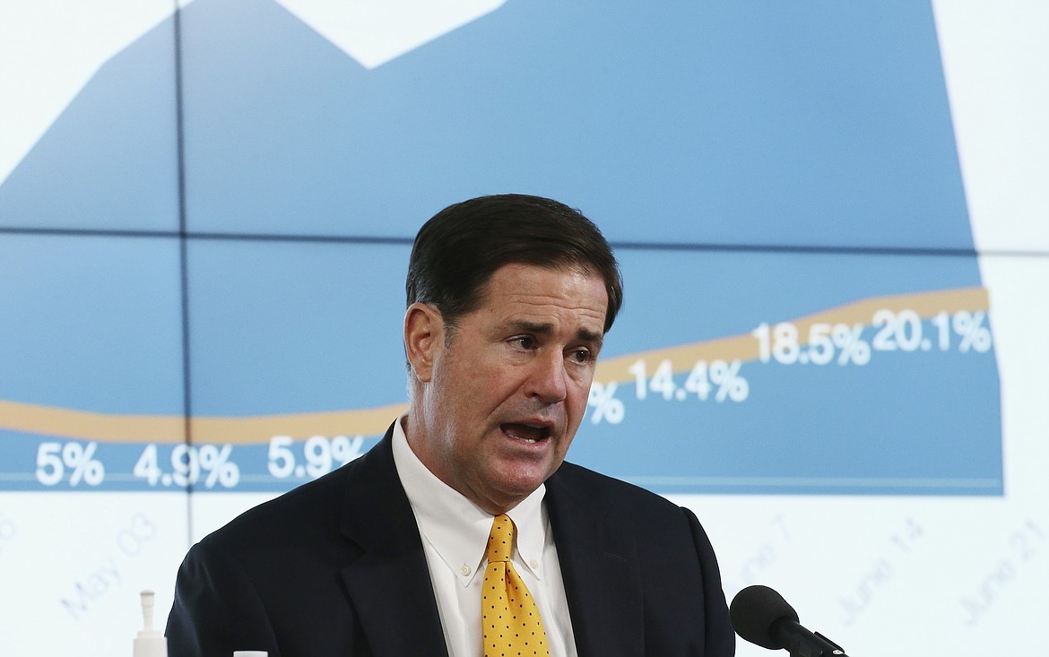 Arizona Republican Gov. Doug Ducey speaks about the latest coronavirus testing and percentage of positive test results data at a news conference Thursday, June 25, 2020, in Phoenix. (AP Photo/Ross D. Franklin, Pool)