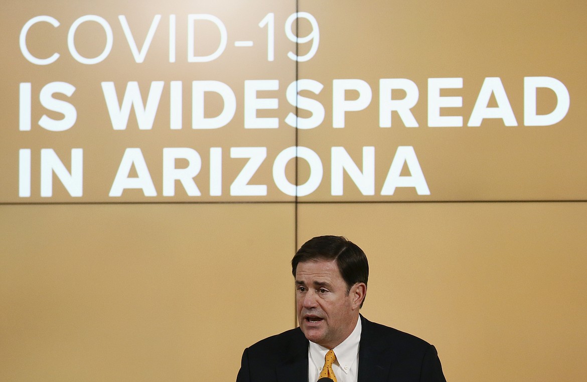 Arizona Republican Gov. Doug Ducey speaks about the latest coronavirus data at a news conference Thursday, June 25, 2020, in Phoenix. (AP Photo/Ross D. Franklin, Pool)