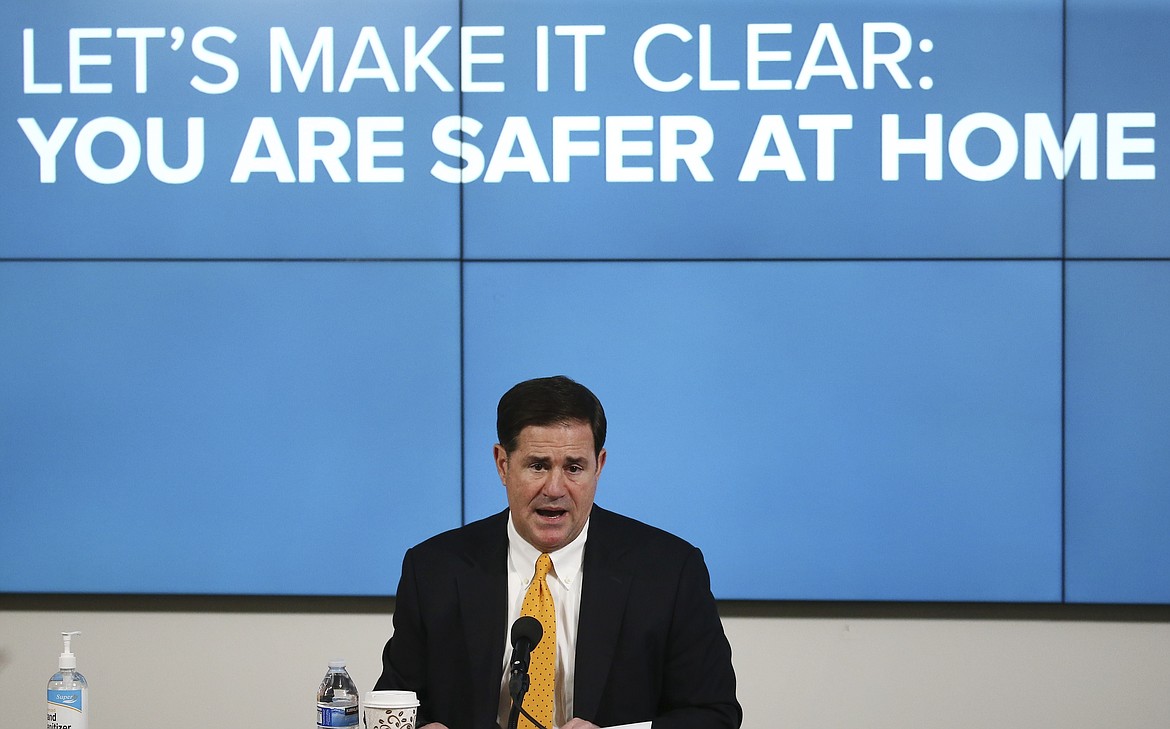 Arizona Republican Gov. Doug Ducey speaks about the latest coronavirus data at a news conference Thursday, June 25, 2020, in Phoenix. (AP Photo/Ross D. Franklin, Pool)