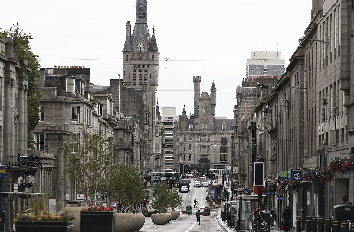 A view of Union Street, after bars, cafes and restaurants were ordered to close as lockdown restrictions were reimposed due to a coronavirus cluster in the area, in Aberdeen, Scotland, Wednesday, Aug. 5, 2020.  A five-mile travel rule has been put in place and residents are being told not to enter each other's houses as First Minister Nicola Sturgeon said over 50 cases have now been reported. (Andrew Milligan/PA via AP)