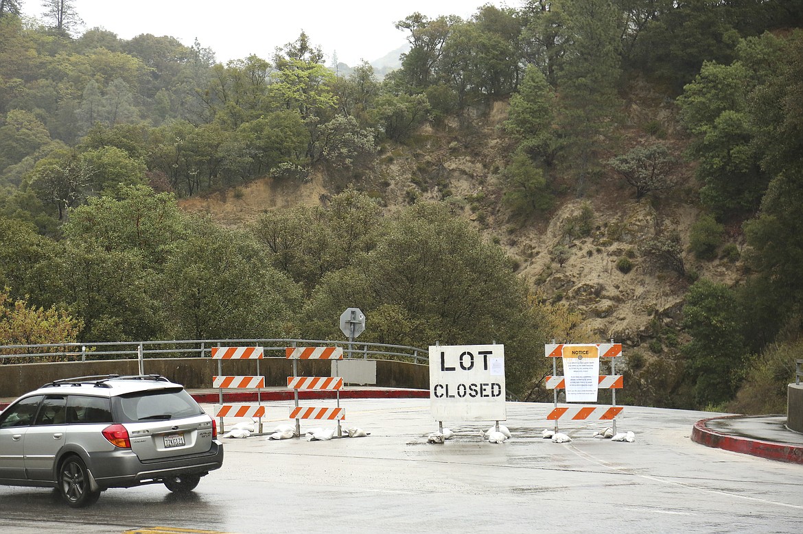 The parking lot at the Highway 49 bridge at the South Yuba River State Park, is closed Saturday, March 28, 2020 due to health and safety concerns regarding the coronavirus. The South Yuba River State Park, as well as Malakoff Diggins, and portions of Empire Mine State Historic Park, remain open.  (Elias Funez/The Union via AP)