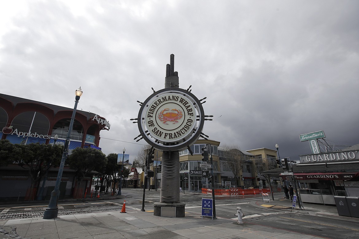 A nearly empty Fisherman's Wharf area of San Francisco, is seen Sunday, March 29, 2020. (AP Photo/Jeff Chiu)