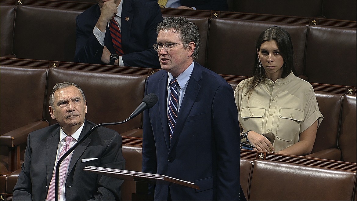 In this image from video, Rep. Thomas Massie, R-Ky., speaks on the floor of the House of Representatives at the U.S. Capitol in Washington, Friday, March 27, 2020. (House Television via AP)