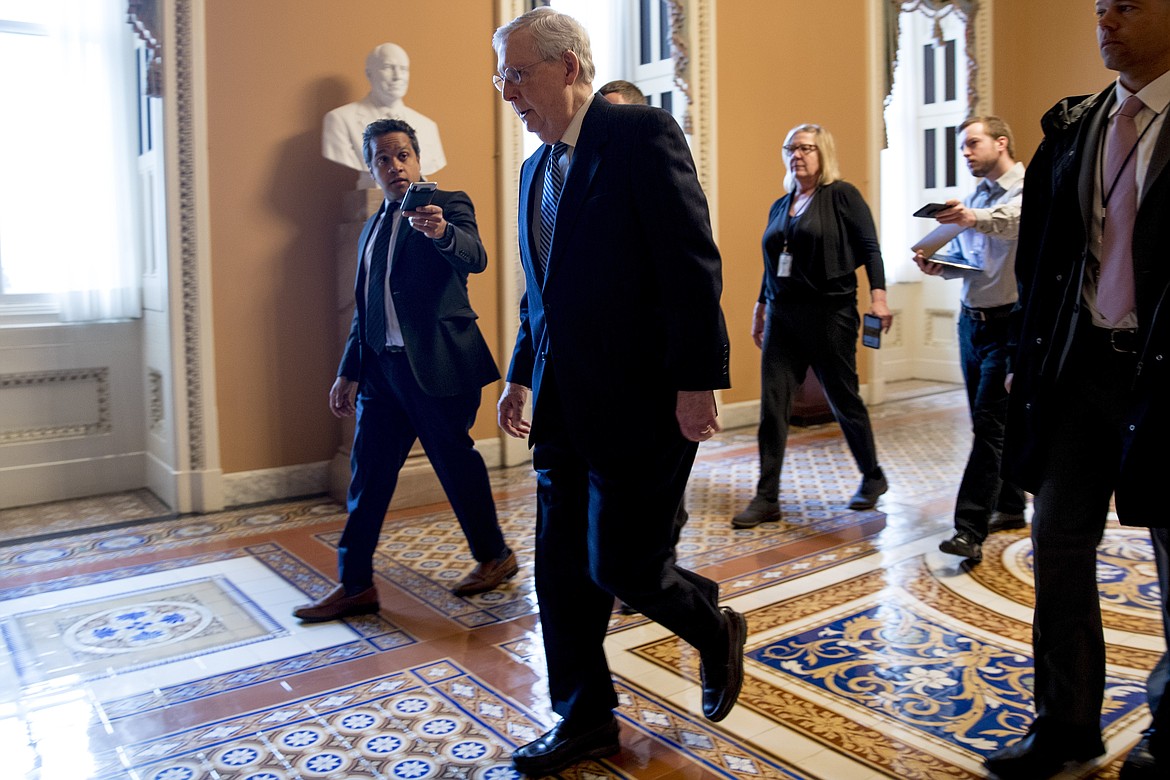 Senate Majority Leader Mitch McConnell of Ky. arrives on Capitol Hill in Washington, Monday, March 23, 2020, as the Senate is working to pass a coronavirus relief bill. (AP Photo/Andrew Harnik)