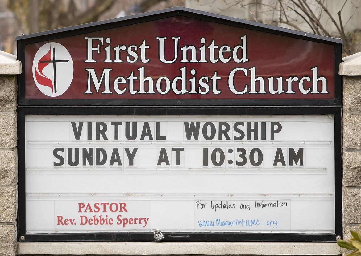 A sign outside the First United Methodist Church in Moscow, Idaho, notifies members on Wednesday, March 18, 2020, that church services will be held online. The temporary change was made to help slow the spread of the COVID-19 coronavirus. (Geoff Crimmins/Moscow-Pullman Daily News via AP)