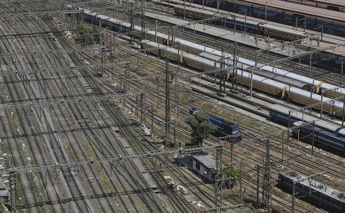 Trains are parked at Chhatrapati Shivaji Maharaj Terminus in Mumbai, India, Sunday, March 22, 2020. India is Sunday observing a 14-hour "people's curfew" called by Prime Minister Narendra Modi in order to stem the rising coronavirus caseload in the country of 1.3 billion. For most people, the new coronavirus causes only mild or moderate symptoms. For some it can cause more severe illness. (AP Photo/Rafiq Maqbool)