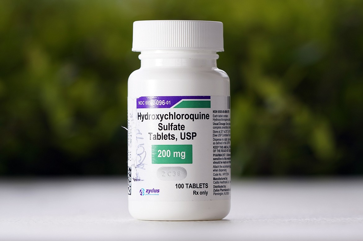 FILE - This Tuesday, April 7, 2020 file photo shows a bottle of hydroxychloroquine tablets in Texas City, Texas. On Friday, April 24, 2020, the U.S. Food and Drug Administration warned doctors against prescribing the malaria drug to treat COVID-19 outside of hospitals or research settings. (AP Photo/David J. Phillip)