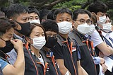 The Latest: Oregon, Kansas set to require face coverings
