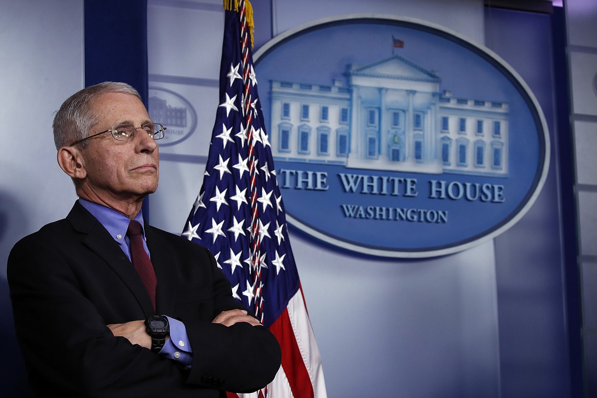 Dr. Anthony Fauci, director of the National Institute of Allergy and Infectious Diseases, listens during a briefing about the coronavirus in the James Brady Press Briefing Room, Friday, March 27, 2020, in Washington. (AP Photo/Alex Brandon)