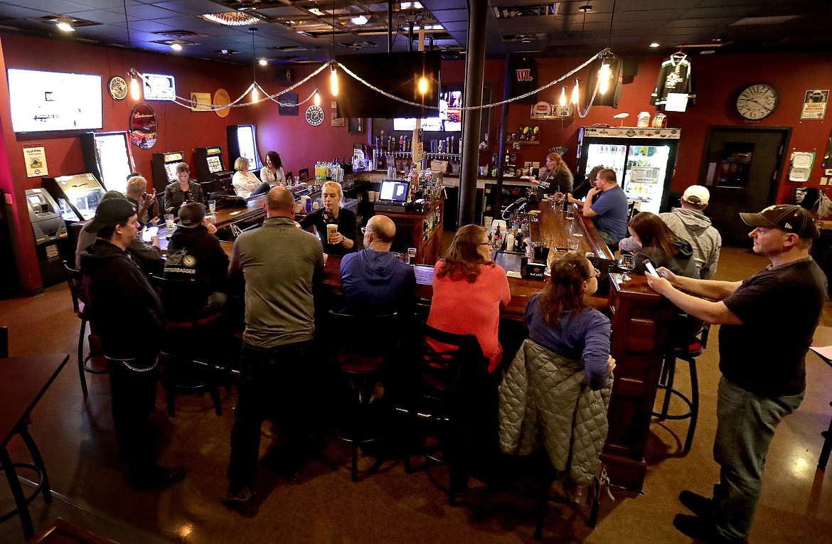 The Dairyland Brew Pub opens to patrons following the Wisconsin Supreme Court's decision to strike down Gov. Tony Evers' safer-at-home order amid the coronavirus pandemic, Wednesday, May 13, 2020, in Appleton, Wis. (William Glasheen/The Post-Crescent via AP)