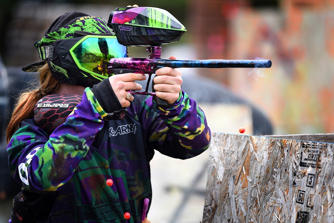 Montana Action Paintball owner Nicholas Lynn miraculously avoids three paintballs while returning fire at his foes. (Jeremy Weber photos/Daily Inter Lake)