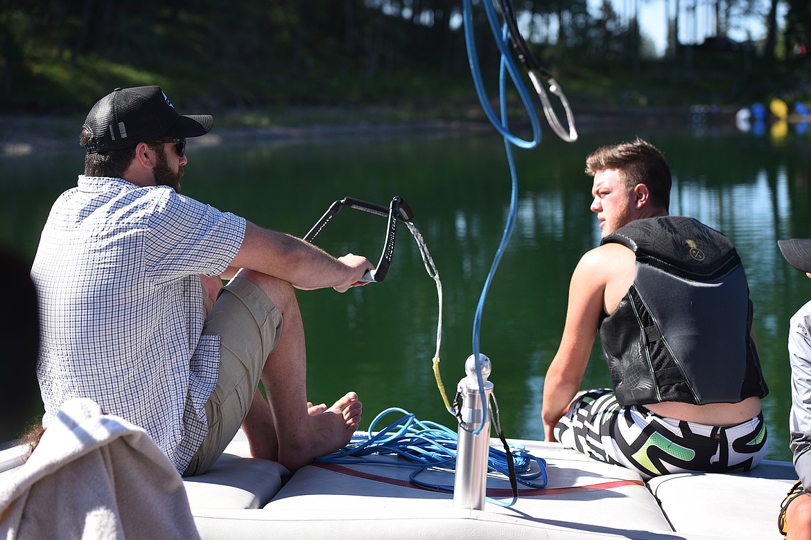 Flathead Wakeboard Academy owner Drew Hollinger goes over techniques with Kalispell's Kaden Nelson before hitting the lake. (Jeremy Weber/Bigfork Eagle)