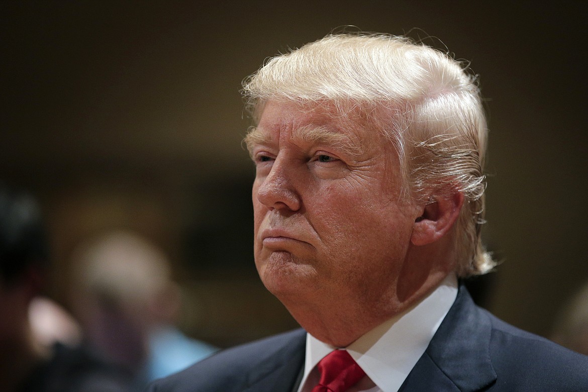 Republican presidential candidate Donald Trump visits a caucus site, Monday, Feb. 1, 2016, in West Des Moines, Iowa. (AP Photo/Jae C. Hong)