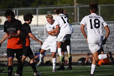 Glacier’s Hunter Lisowski (6) and Campbell Smith (12) celebrate after Lisowski’s first-half goal against Flathead during crosstown soccer at Legends Stadium on Thursday. (Casey Kreider/Daily Inter Lake)