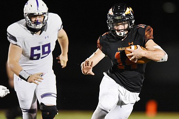Flathead running back Alec Thomas (14) picks up yardage on a third quarter run against Butte at Legends Stadium on Friday. (Casey Kreider/Daily Inter Lake)