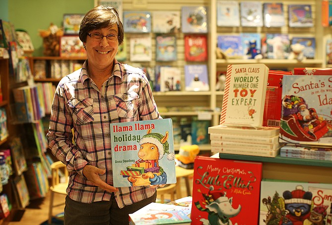 Melissa DeMotte, owner The Well-Read Moose Bookstore in Riverstone, is a retailer who sees things picking up this holiday retail season especially with kids book sales. (LOREN BENOIT/Business Journal)