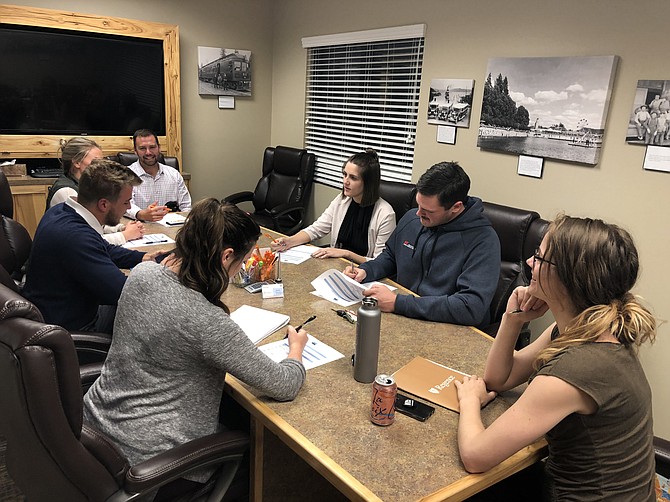 Board members of Kootenai County Young Professionals share ideas as they engage in conversation at their Oct. 4 meeting. Counter-clockwise, from center: Ashley Yates, James Perkinson, Heather Twidt, Jesse Johnson, Cassidy Bones, Arwyn Robinson and Jacob Bonwell. (Courtesy photo)