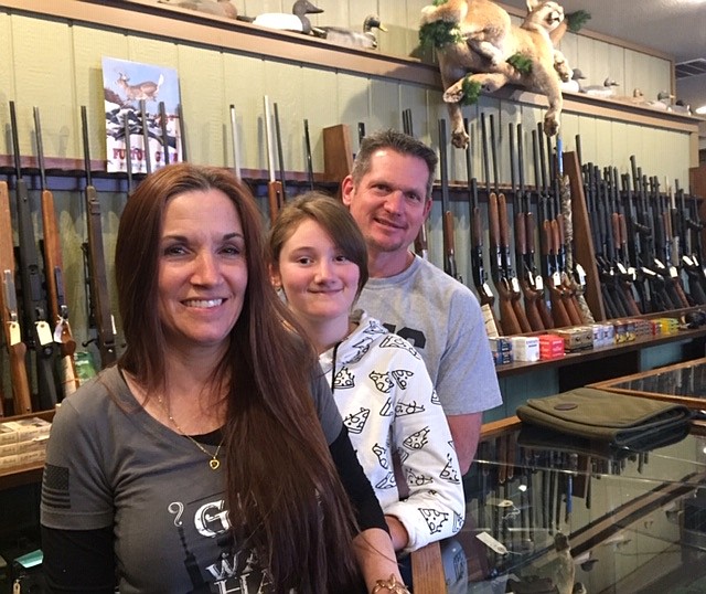 Kinsey, Kylie and Marc Boyle pose for a photo inside Triple B Guns, the shop the family owns in Coeur d’Alene.