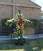 Flowers cover cross to add color for Easter