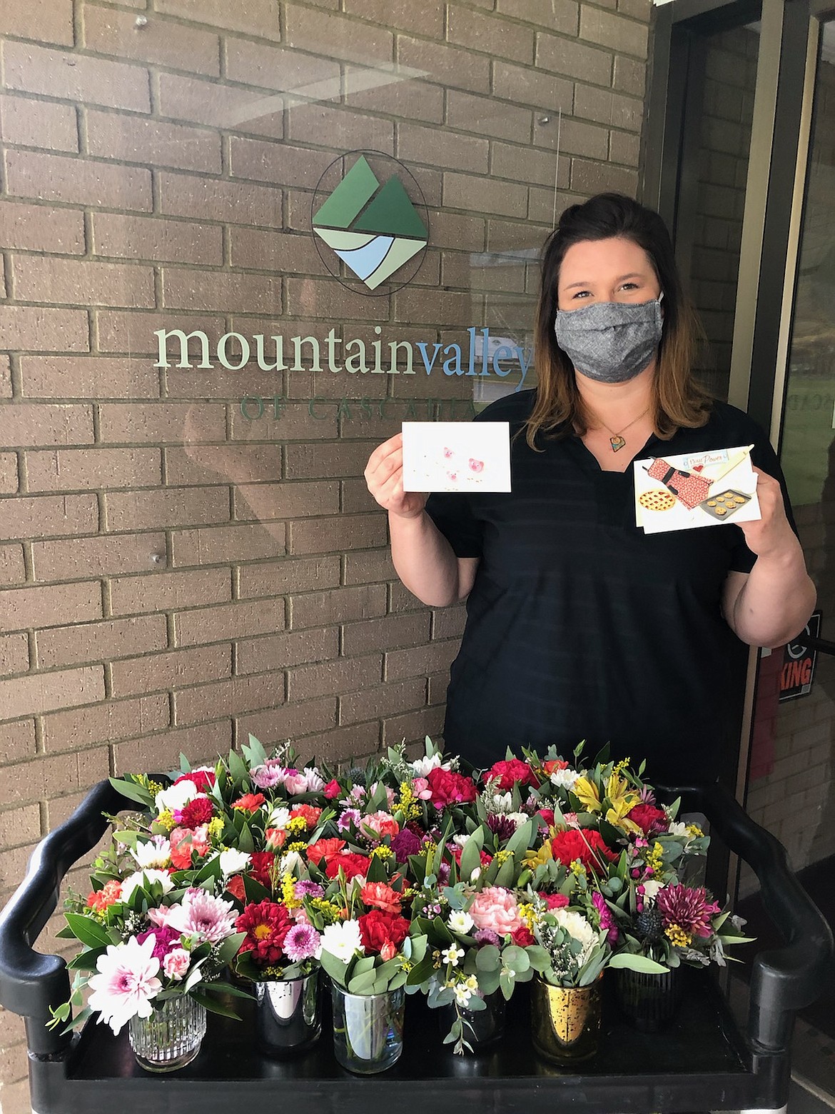 Rehab Program Director Tara Lodi poses out front of Mountain Valley of Cascadia in Kellogg after the facility receives their May Day surprise of flowers, cards, and gift cards.