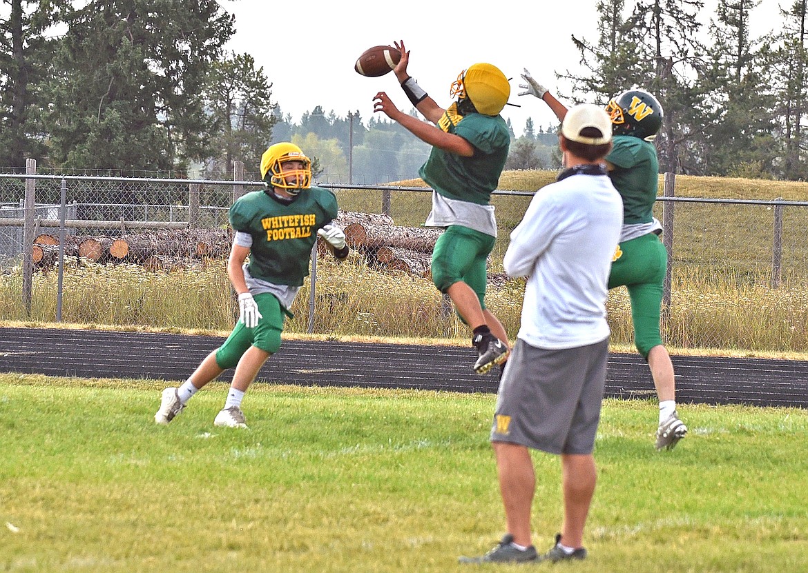 The Whitefish football team practices executing plays on Aug. 20 at Whitefish High School. (Whitney England/Whitefish Pilot)