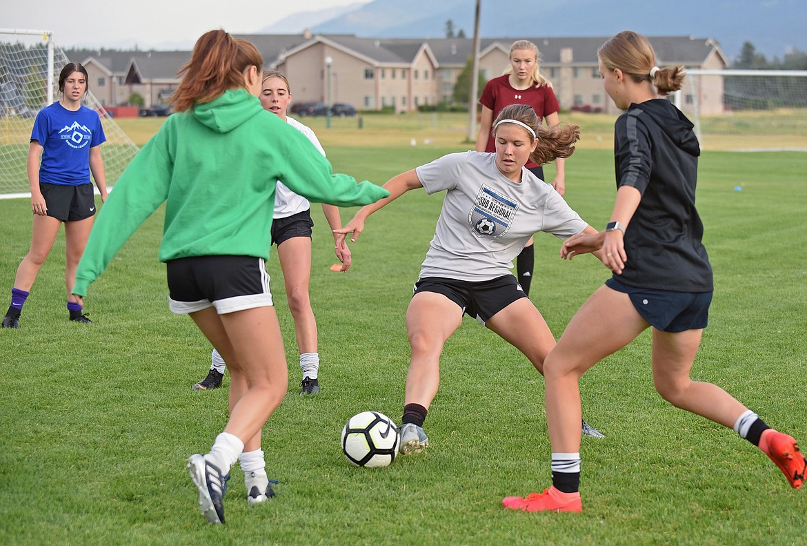 Whitefish girls soccer central midfielder Emma Barron incercepts the ball during a drill at practice on Aug. 20 at Smith Fields. (Whitney England/Whitefish Pilot)