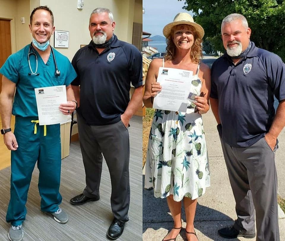 Kristyn Siciliani and Mike Schallock and presented with letters of Recognition for Heroic Citizenship and Polson Police Department Coins. (Photo provided)