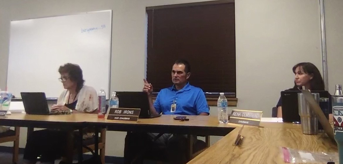 Lakeland School Board Vice Chair Rob Irons comments about the district going back to school in the "orange" COVID risk level during a meeting Tuesday. Also pictured: Trustee Ramona Grissom, left and Chairwoman Rena Olmstead. (Image via Facebook)