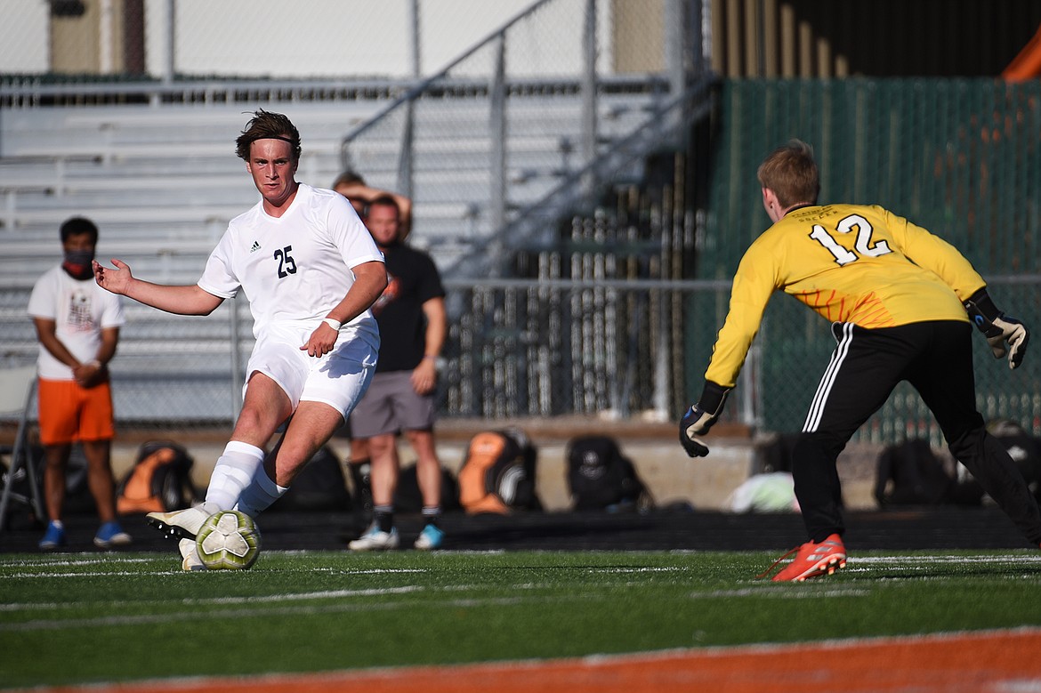 Glacier’s Braden Nitschelm (25) scores a second-half goal against Flathead during crosstown soccer at Legends Stadium on Thursday. (Casey Kreider/Daily Inter Lake)