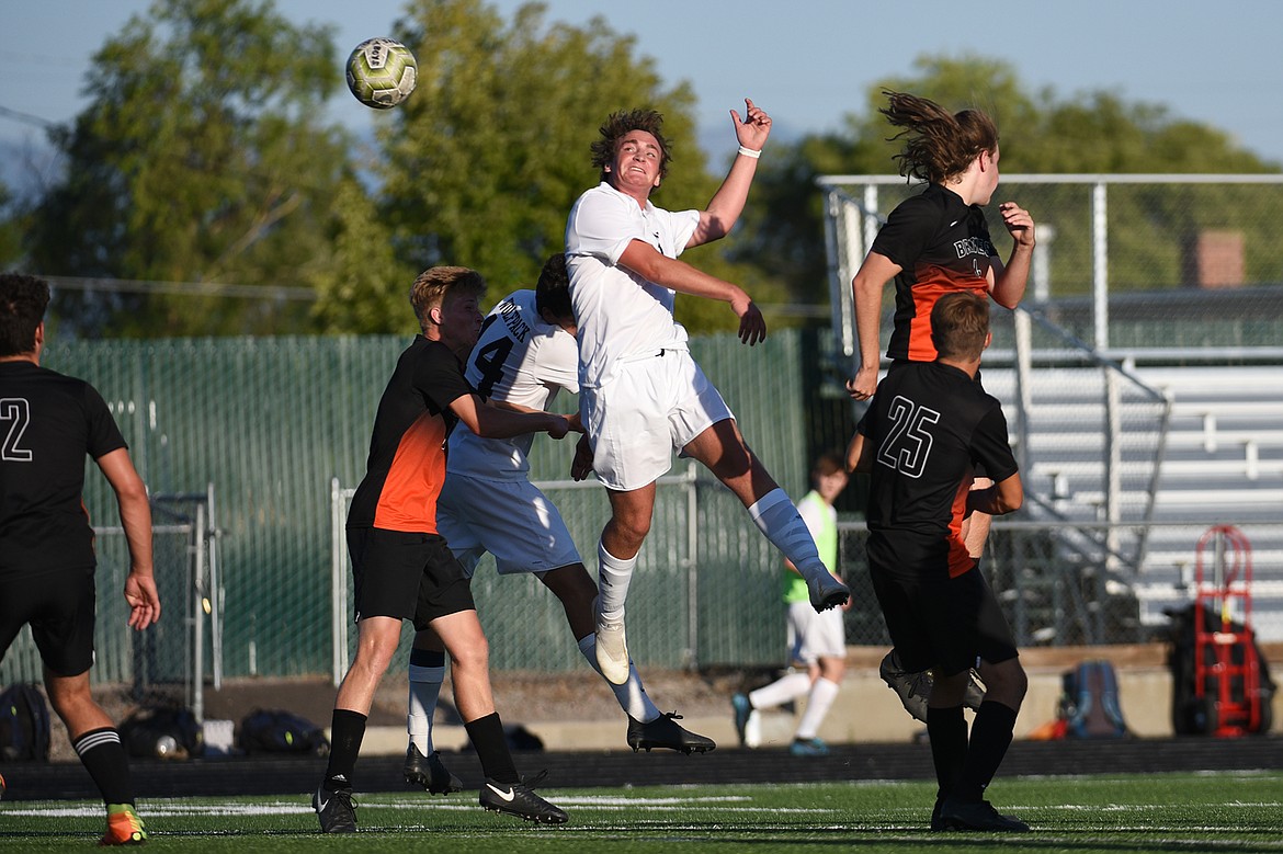 Glacier’s Braden Nitschelm (25) heads a ball toward the Flathead goal during crosstown soccer at Legends Stadium on Thursday. (Casey Kreider/Daily Inter Lake)