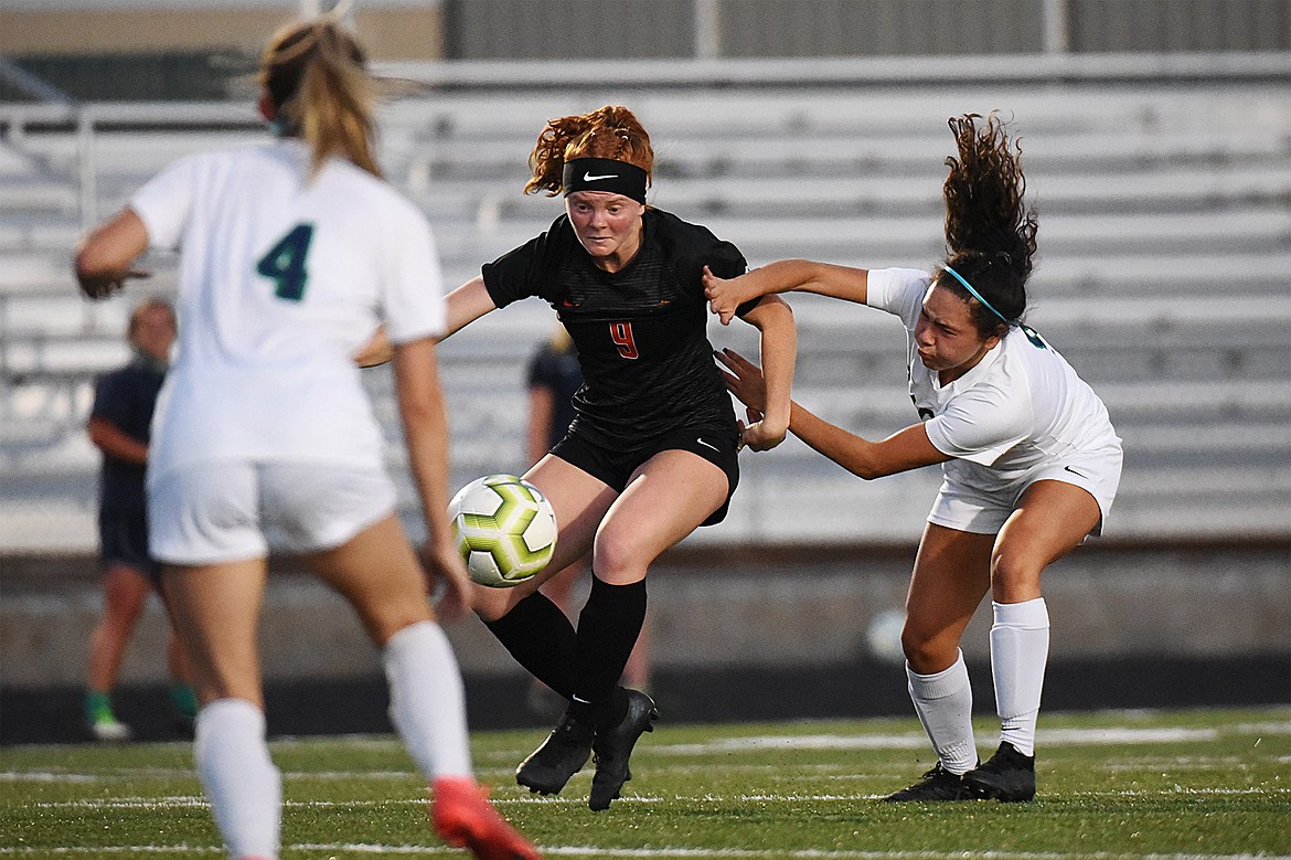 Flathead’s Skyleigh Thompson (9) gets a look in the Glacier zone during crosstown soccer at Legends Stadium on Thursday. (Casey Kreider/Daily Inter Lake)
