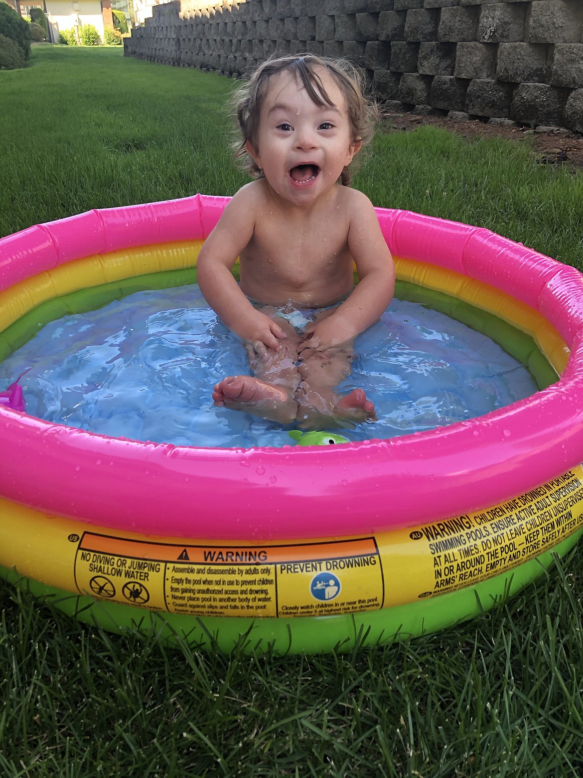 Cruz Choate, who was born in Moses Lake but now lives in the Spokane area, beats the heat in a kiddie pool.