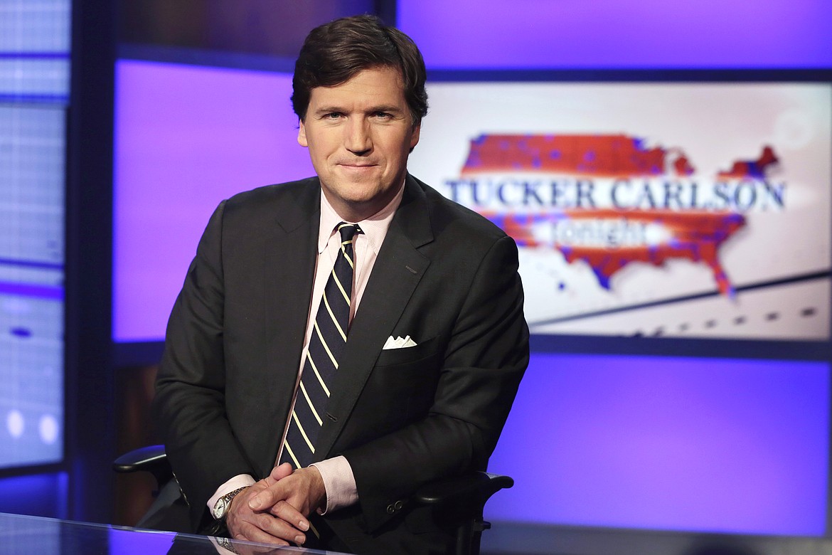 AP Photo/Richard Drew, File
In this March 2, 2017, file photo Tucker Carlson, host of "Tucker Carlson Tonight," poses for photos in a Fox News Channel studio, in New York. Carlson is being criticized for suggesting that no one should be surprised by the killing of two demonstrators during social unrest in Kenosha, Wis. Authorities “stood back and watched Kenosha burn,” he said on Fox News Channel on Wednesday, Aug. 27, 2020. “So are we really surprised that looting and arson accelerated to murder? How shocked are we that 17-year-olds with rifles decided they had to maintain order when no one else would?”