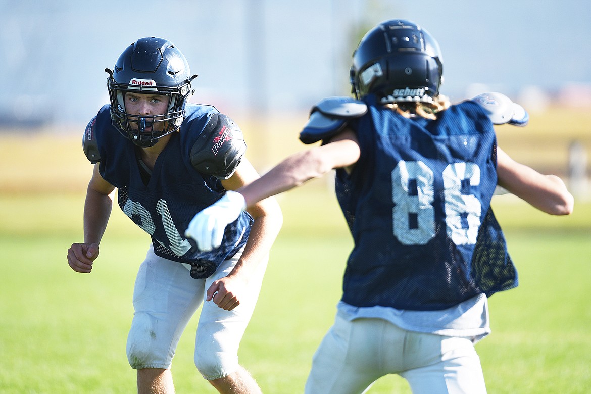 Glacier defensive back Casey Peiffer (21) covers a wide receiver during practice at Glacier High School on Wednesday, Aug. 26. (Casey Kreider/Daily Inter Lake)