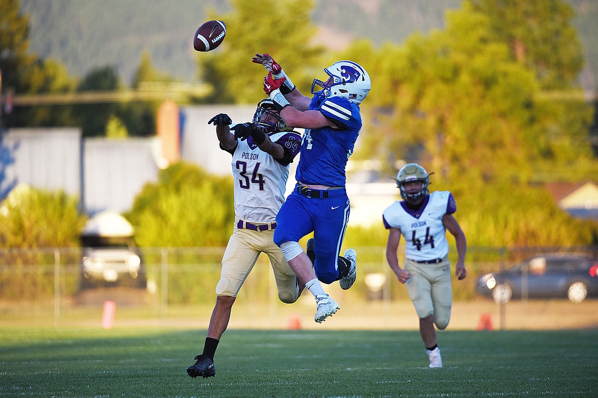 Polson’s Boston Goode (34) knocks away a pass intended for Columbia Falls wide receiver Jordan Knapton (34) in the second quarter at Satterthwaite Memorial Field on Friday. (Casey Kreider/Daily Inter Lake)